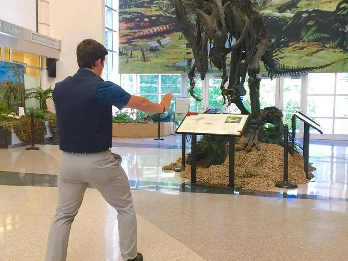 Marketing intern Eddie Bowman is channeling his inner Chris Pratt by taming the Acrocanthosaurus!