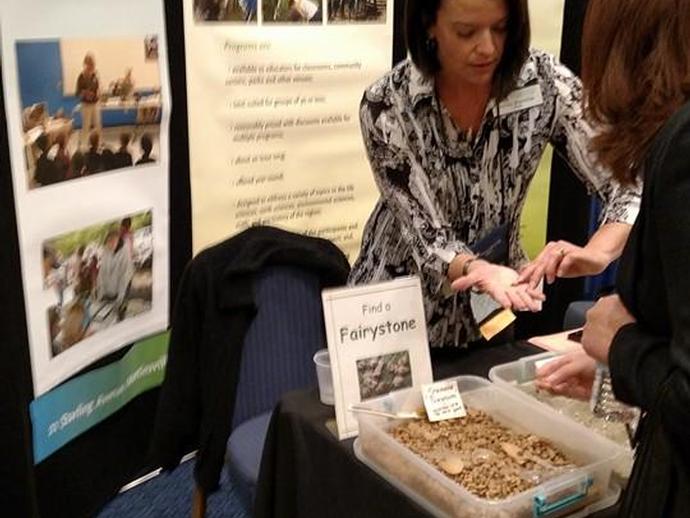 Outreach educator Christy Deatherage at the VMNH booth at VAST conference