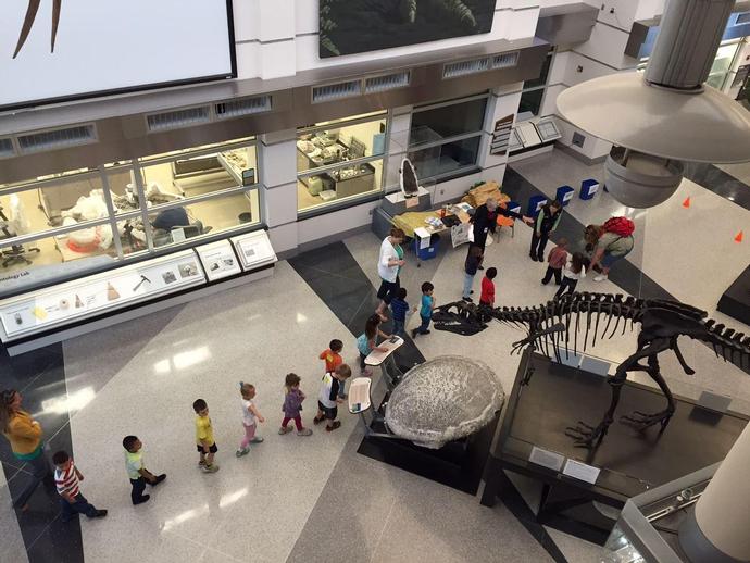 Students line-up to take part in a recycling activity at the museum during our annual Earth Day ...