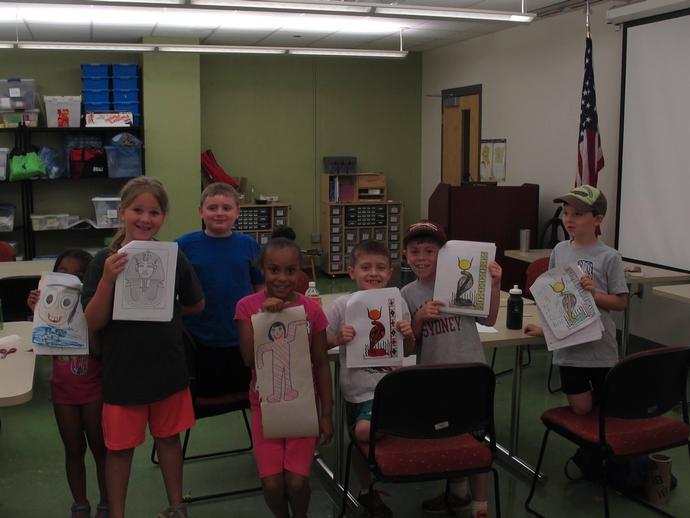 Adventure Egypt Campers show off their art work they worked hard on!