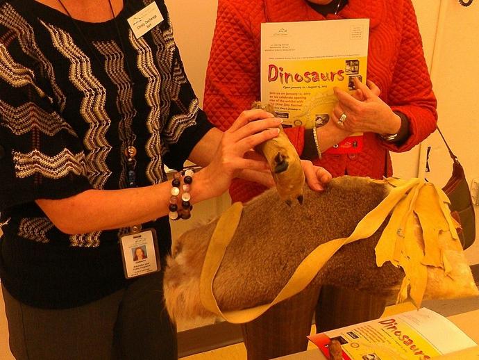 Educator Christy Deatherege shows off one of our Native American teaching kits to retired ...