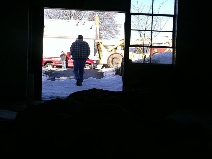 Prepping forklift to move the rest of the skull, seen here in silhouette