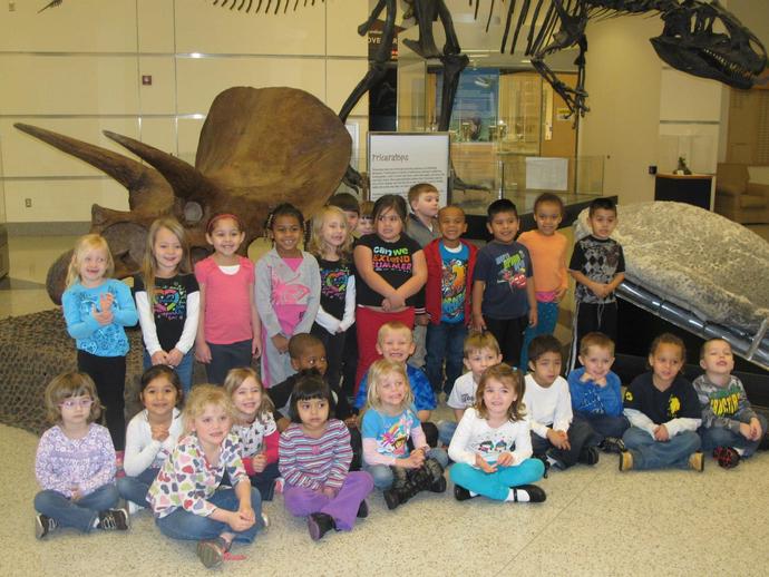 Students from Stanleytown Elementary School enjoy the dinosaurs in the Harvest Foundation Hall ...