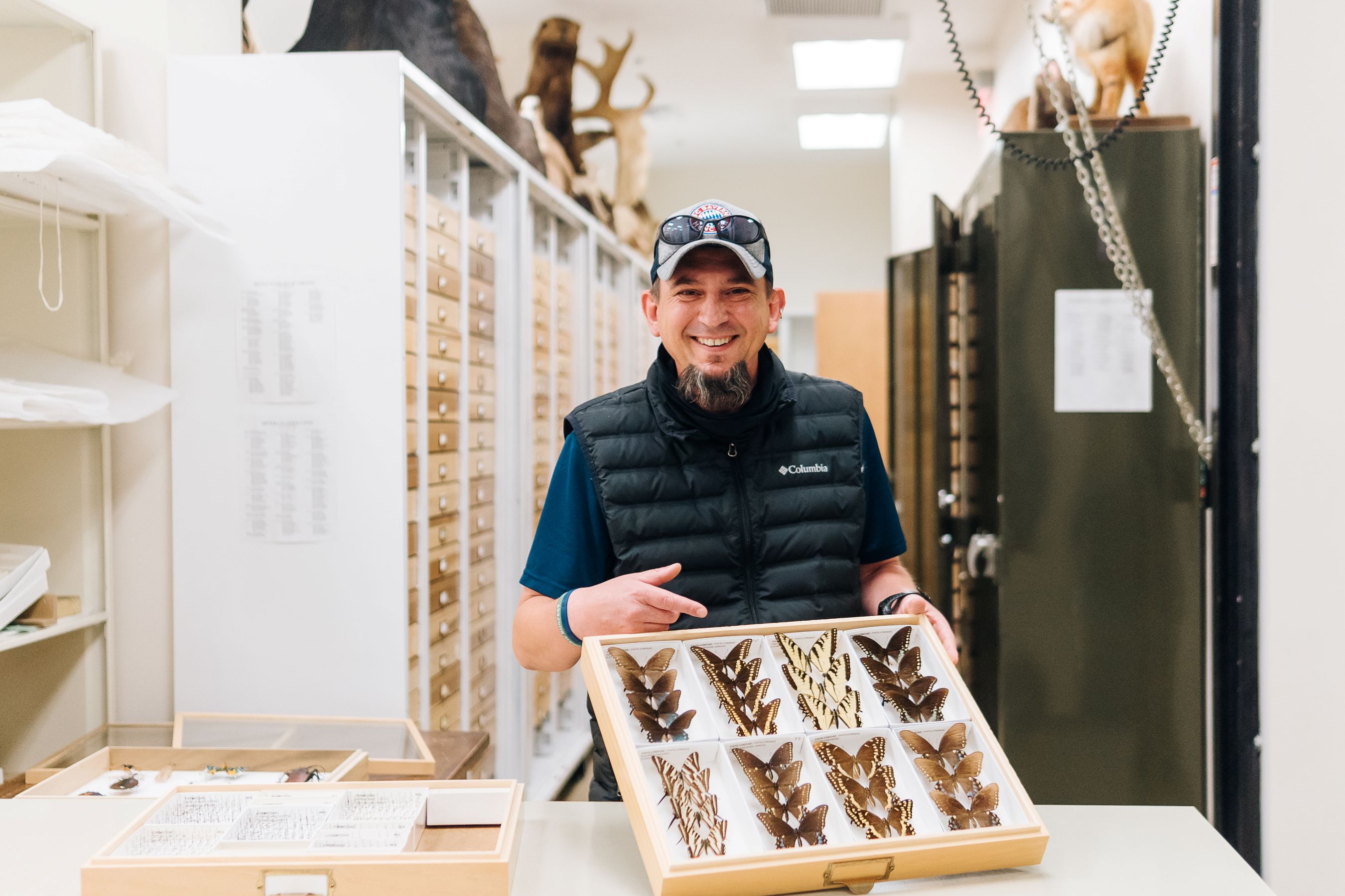 Dr. Kal Ivanov displaying specimens from the museum collections
